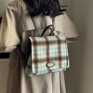 Plaid wool backpack with mint green and brown check patterns and leather straps