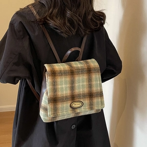 Mini green plaid backpack for women featuring leather trim and premium metallic logo