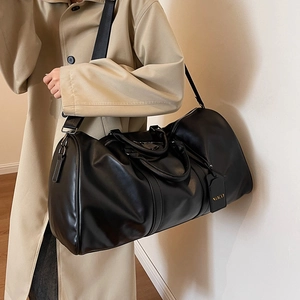 Black large capacity faux leather travel bag with adjustable shoulder strap for women