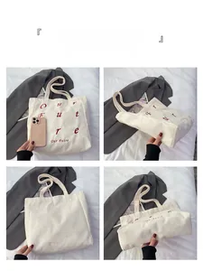 Detail view of white corduroy tote bag showing front red embroidery, side, and back views