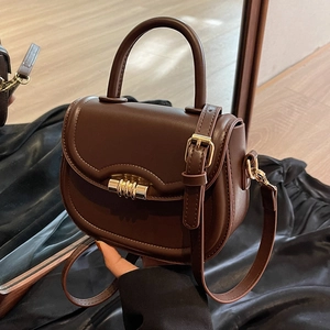 Retro dark brown saddle bag with wavy edge and golden twist lock for women