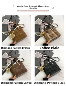 Detail view of four textured bucket bags with diamond patterns and plush charms