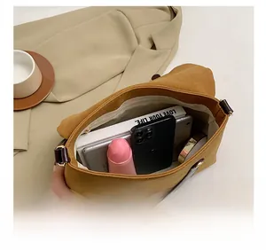 Detailed interior view of spacious mustard canvas tote showing large storage capacity