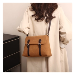 Retro caramel suede tote bag with brown leather straps shown on model from behind