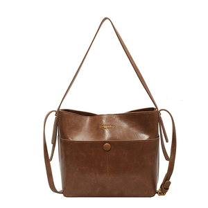 Retro dark brown bucket bag for women featuring vintage leather texture and tote style