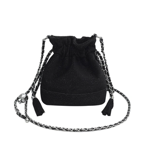 Chic black drawstring bucket bag with silver chain strap and skull charm detail