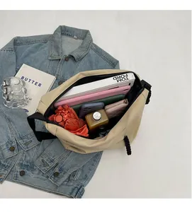 Spacious interior of beige tote bag showing large capacity for umbrella, bottle and tablet