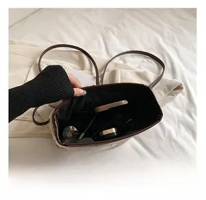 Interior view showing large capacity for phone, cosmetics in the tweed tote bag