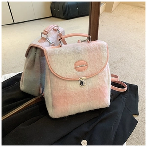 Detail of pink and white checkered plush backpack with leather strap and monmon logo