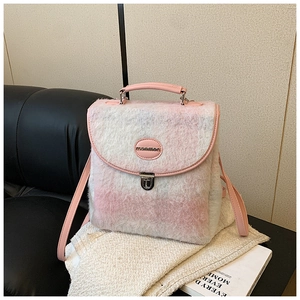 Detail of pink plaid plush backpack with leather trim and metallic buckle closure