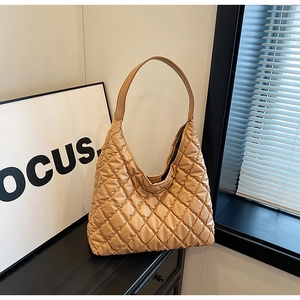 Detail showing high-quality quilted stitching on the soft khaki hobo shoulder bag for women