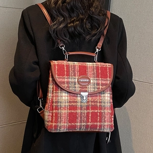 Classic British plaid backpack with leather straps and silver twist lock in red and grey
