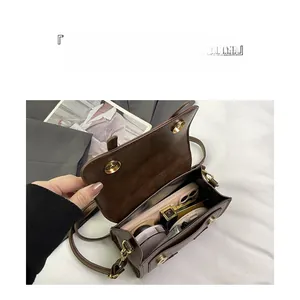 Interior view of brown faux leather crossbody bag showing spacious storage compartments