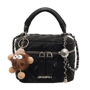 Quilted black chain bag with silver ball adjuster and cute plush monster charm