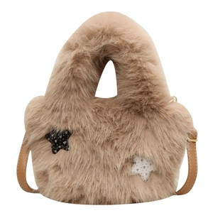 Fuzzy light brown plush bucket bag with star patches and adjustable shoulder strap
