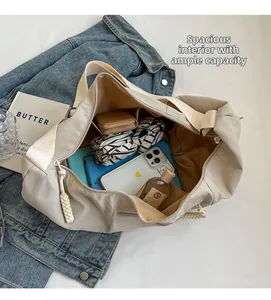Spacious interior of beige nylon dumpling bag showing large capacity for daily items