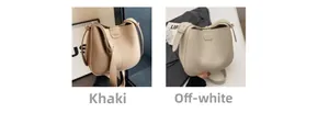 Vue détaillée des sacs seaux kaki et crème en cuir grainé avec bandoulière large