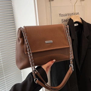 Brown corduroy tote bag with silver chain strap and metal buckle, vintage stylish design