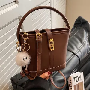 Women Retro PU Leather Bucket Bag Contrast Color Gold Metal Lock Crossbody Shoulder Bag With Plush Monster Pendant Handbag