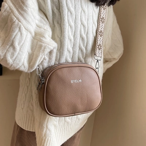 Brown lychee leather crossbody bag with wide bohemian style embroidered strap