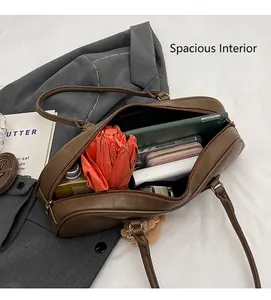 Top view of large capacity vintage brown boston bag showing spacious interior with essentials