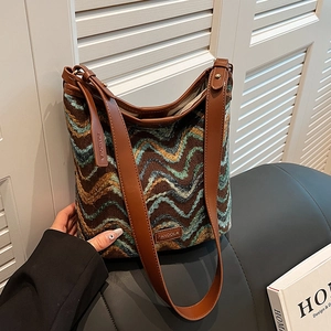 Retro bohemian knit bucket bag with chevron pattern and brown leather straps