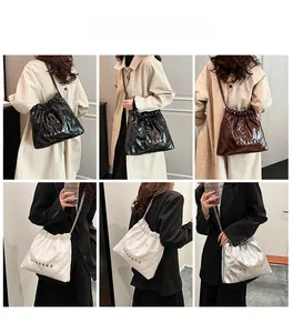 Quilted bucket bag options in black, brown, white and silver with chain straps