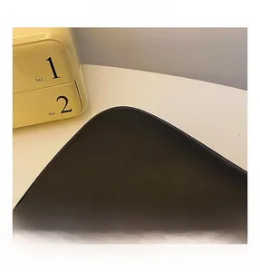 Close-up of black PU leather texture with fine stitching and rounded R-corner design