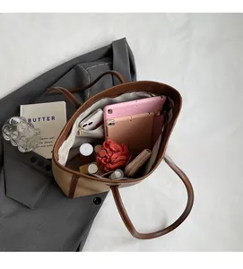 Top view of spacious tote bag interior showing capacity for tablets and daily essentials