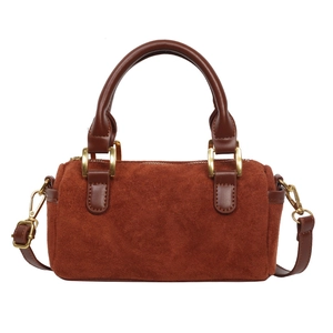 Retro dark brown suede Boston barrel bag with leather straps and gold metal hardware
