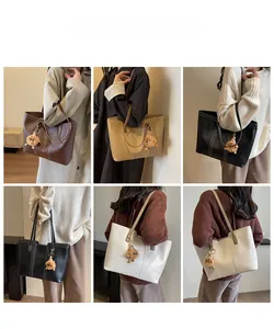 Detail shots showing retro leather tote bags in four colors with white topstitch details