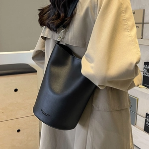 Chic black leather bucket bag with silver hardware for urban commuting and styling