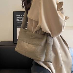Quilted puffer tote bag for women in grey finish with wide shoulder strap