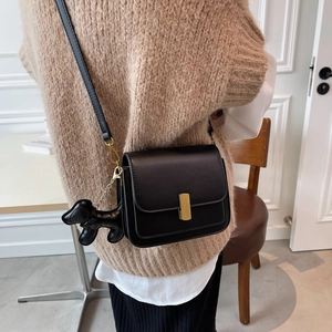 Classic black crossbody square bag with gold buckle and cute puppy charm for women