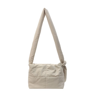 Minimalist beige quilted crossbody puffer bag with wide strap and knot detail
