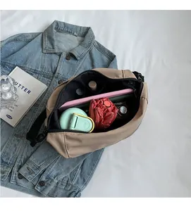 Spacious interior of khaki nylon tote bag showing umbrella and tablet storage