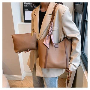 Brown litchi grain tote bag with pink scarf and matching inner pouch shown on model