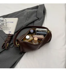 Deep brown lychee pattern Boston bag with large capacity showing spacious interior space