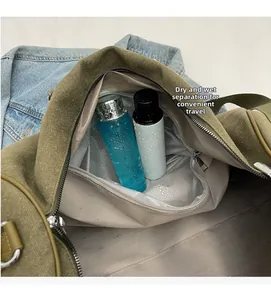 Detail of army green travel bag featuring a dedicated dry and wet separation waterproof layer