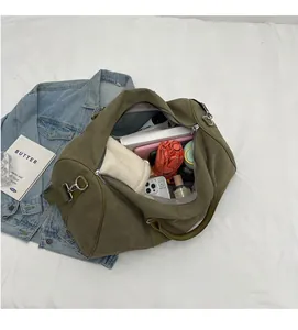 Spacious interior of an olive green canvas travel bag showing large storage capacity