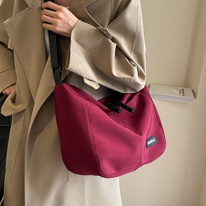 Deep red nylon tote bag for women with adjustable strap and large capacity design