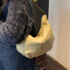Olive green corduroy hobo bag with adjustable wide strap and metallic zipper