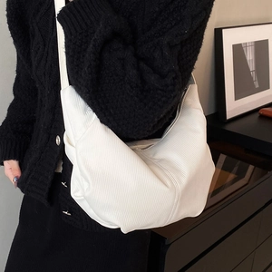 White minimalist pleated hobo bag with vintage crescent shape and slim shoulder strap