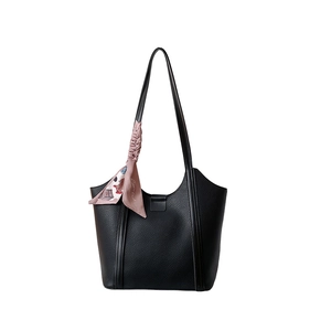 Large black pebbled leather tote bag with elegant floral scarf on handle for daily use