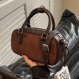 Retro brown suede Boston bag with leather trim and top handles in a classic crossbody style