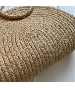 Detailed close-up of natural woven straw texture and artisan spiral handicraft on beach bag