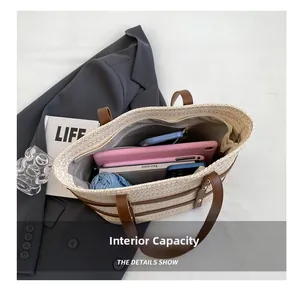 Large straw tote bag interior showing capacity for tablet, umbrella, and essentials