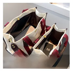Interior view of tote bag showing large capacity storage with zipper pocket and phone slot