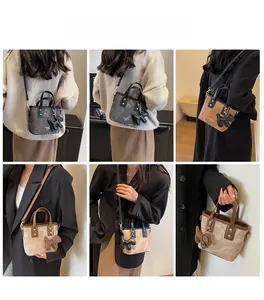 Multiple views of mini bucket bag with puppy charm in marble grey and vintage brown colors