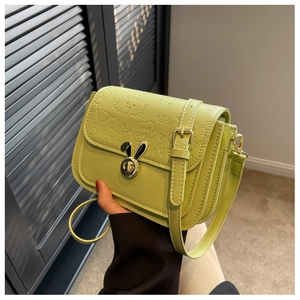 Detail of light green PU leather bag featuring rabbit ear clasp and love songs embossing